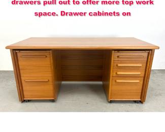 Lot 251 MCM Danish Teak Desk. Both sets of drawers pull out to offer more top work space. Drawer cabinets on