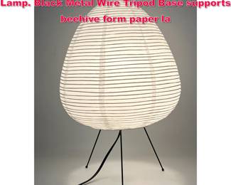 Lot 382 A Japanese Paper Akari style Table Lamp. Black Metal Wire Tripod Base supports beehive form paper la