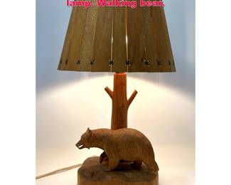 Lot 324 Clement Dube carved wood table lamp. Walking bear.