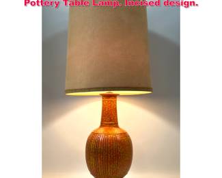 Lot 335 Mid Century Modern Orange Glazed Pottery Table Lamp. Incised design.