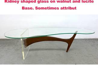 Lot 93 Vladimir Kagan Style Coffee Table. Kidney shaped glass on walnut and lucite Base. Sometimes attribut