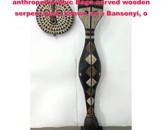 Lot 173 2pcs African Carvings. tall, anthropomorphic Baga carved wooden serpent post, known as a Bansonyi, o