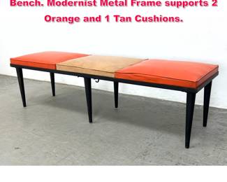Lot 605 PENNANT Black Metal Three Seater Bench. Modernist Metal Frame supports 2 Orange and 1 Tan Cushions.