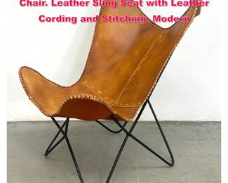 Lot 426 Black Iron MCM Butterfly Lounge Chair. Leather Sling Seat with Leather Cording and Stitching. Modern