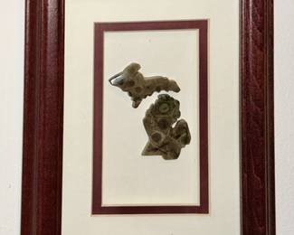 Petosky stones carved in the shape of Michigan including the UP