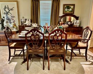 This double pedestal dining table currently has leaves IN, so it will get smaller!