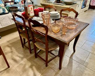 This sweet parquet top DRAW LEAF Frenchy table selling separately from the SET OF SIX Marie Albert rush seat chairs. The legs are a bit beefier than most we see….