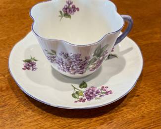 Shelley bone china teacup and saucer set in the "Lilac Time" pattern.
