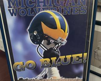 Vintage poster for the Michigan Wolverines football team.
