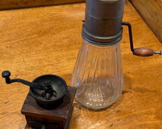 antique-style coffee grinder and vintage glass and metal nut grinder.