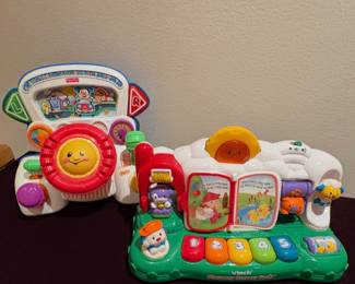 VTech Discovery Nursery Farm and a Fisher-Price Laugh & Learn Rumble & Learn
Driver.