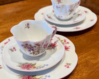 Shelley bone china tea set in the "Rosebud" pattern, featuring a teacup, saucer, and luncheon plate. 