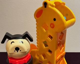 Fisher-Price Peek-a-Blocks Tumblin' Sounds
Giraffe toy. And Fisher-Price Little People Stacking Puzzle Puppy,