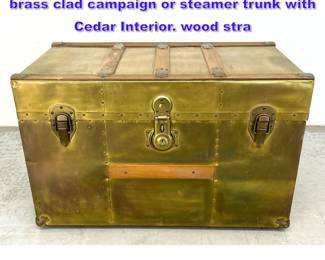 Lot 752 George C. Brown and Company Inc. brass clad campaign or steamer trunk with Cedar Interior. wood stra