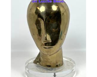 Lot 859 Brancusi Style Brass Head Sculpture on Lucite Base. 