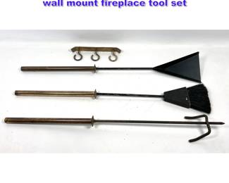 Lot 946 Modernist wrought iron and brass wall mount fireplace tool set