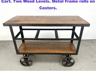 Lot 748 Industrial Wood and Steel Rolling Cart. Two Wood Levels. Metal Frame rolls on Casters. 