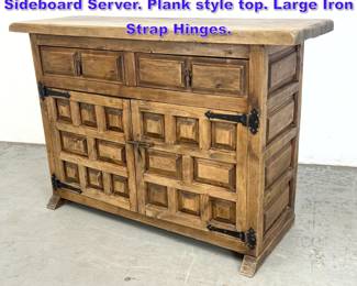 Lot 749 Rustic Paneled Door Continental Sideboard Server. Plank style top. Large Iron Strap Hinges. 