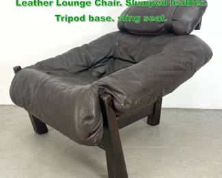 Lot 1448 1970s Gerhard Van Den Berg Leather Lounge Chair. Slumped leather. Tripod base. sling seat. 