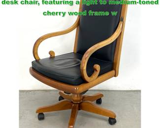 Lot 1423 GRANGE traditionalstyle executive desk chair, featuring a light to mediumtoned cherry wood frame w