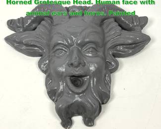 Lot 1919 Architectural Painted Plaster Horned Grotesque Head. Human face with animal ears and horns. Painted 