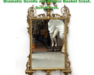 Lot 1590 Highly Ornate Gilt Framed Mirror. Dramatic Scrolls and Flower Basket Crest. Scroll Feet. 