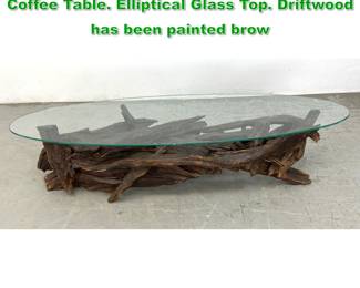 Lot 1428 Assembled Natural Driftwood Base Coffee Table. Elliptical Glass Top. Driftwood has been painted brow