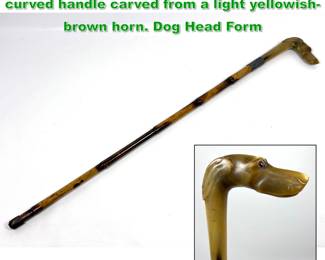 Lot 1712 Antique sword cane featuring a curved handle carved from a light yellowishbrown horn. Dog Head Form