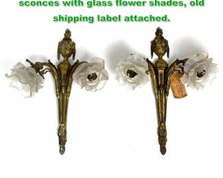Lot 1739 Pair of French Empire gilt bronze sconces with glass flower shades, old shipping label attached.
