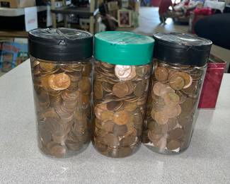 Three big plastic jars of Lincoln Memorial and wheat pennies. I have not searched through them, but what I have seen looks like they are mostly wheat pennies.