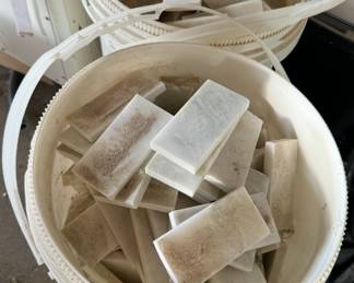 Two buckets of random pieces of white marble backsplash for a powder room. Some tiles are broken Summer in excellent condition. You just have to sort through them. Call if you’re interested and I can get you a square footage