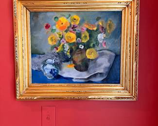 Painting of flowers in ornate gold frame