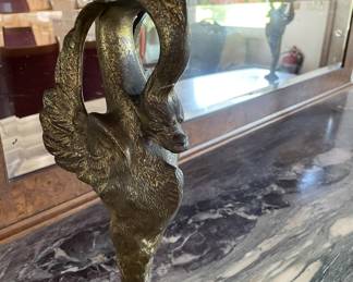 From another era -- check out this beautiful hutch with rounded glass upper cabinet, lower cabinet supported with brass birds and mirror back :)