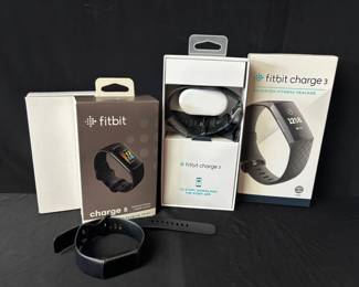 Boxed Fitbit Charge 3 And Charge 5 Fitness Trackers
