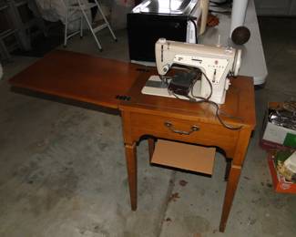 Singer sewing machine with cabinet