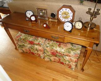 Sofa table, entrace way table, couple of nice smaller ottomans, and a bunch of clocks on top