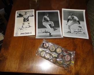 Signed photos, hockey to your left, and baseball front and center and to your right