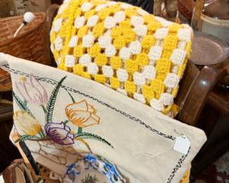 yellow and white afghan, needlework, plates