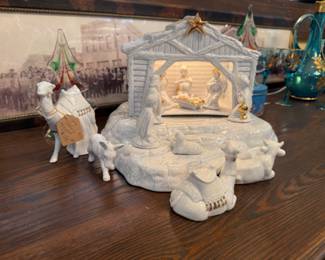 Pretty lit all white and gold nativity scene