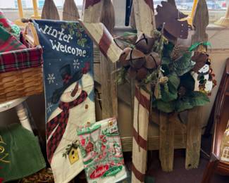 Rustic wooden candy cane with bells, winter flags, vintage ornaments