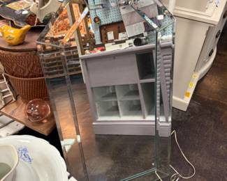 Faceted, frameless decorative mirror