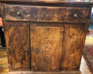 Primitive cabinet with traces of grain painting