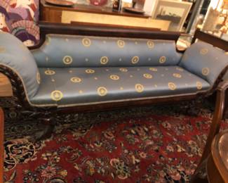 19th-century American Empire mahogany sofa with an intricately hand-carved frame and light blue silk