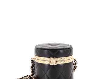 "This exquisite Chanel Lock Frame Round Vanity Case is crafted from luxurious black quilted lambskin leather. The case features stunning gold hardware that adds a touch of elegance, making it a perfect accessory for any occasion. Measuring 3.5 inches in height and 3 inches in depth, it includes a comfortable 21-inch chain strap for effortless wear. The interior, also in black leather, shows some signs of use, including minor indentations and light scuffs, though it remains in great condition overall. A must-have for any Chanel collector or fashion enthusiast.

Victorins Auctions will coordinate all domestic and international shipping. Please allow approximately 10–15 business days for processing. Certain items may require additional handling time depending on their location, origin, or special packaging requirements. By registering for or placing a bid in a Victorins auction, you confirm that you have reviewed, understood, and agreed to our Shipping, Payment, and Auction Policies."
