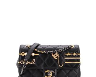 "This elegant Chanel Coco Clips Flap Bag is a stunning accessory for any fashion enthusiast. Crafted from luxurious black quilted lambskin, it features beautiful gold embellishments that add a touch of sophistication. With dimensions of 11.5"" handle drop, 5.5"" height, 8"" width, and 3"" depth, this bag is perfectly sized for everyday use. The interior boasts a sleek gold leather lining. Despite some visible signs of wear, including light scuffs and a slight odor, the bag remains a timeless piece. Ideal for collectors and fashionistas alike.

Victorins Auctions will coordinate all domestic and international shipping. Please allow approximately 10–15 business days for processing. Certain items may require additional handling time depending on their location, origin, or special packaging requirements. By registering for or placing a bid in a Victorins auction, you confirm that you have reviewed, understood, and agreed to our Shipping, Payment, and Auction Policies."
