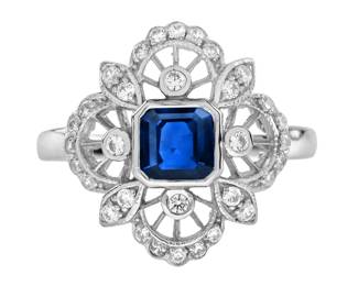 "This exquisite antique-style ring showcases a stunning 1-carat octagon-shaped Ceylon blue sapphire, elegantly set in a bull bezel. Surrounding the vibrant center stone are 32 sparkling round diamonds, enhancing its timeless appeal. Crafted from high-quality 14K white gold, the ring features intricate openwork detailing, making it a perfect statement piece for any occasion. We also offer sizing options, ensuring a perfect fit for your hand. This ring comes with an attractive ring box, ideal for gifting or safe-keeping.

Victorins Auctions will coordinate all domestic and international shipping. Please allow approximately 10–15 business days for processing. Certain items may require additional handling time depending on their location, origin, or special packaging requirements. By registering for or placing a bid in a Victorins auction, you confirm that you have reviewed, understood, and agreed to our Shipping, Payment, and Auction Policies."
