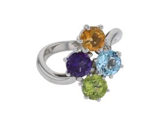 "This stunning ring features a vibrant assortment of gemstones, including amethyst, citrine, peridot, and topaz, all elegantly set in a luxurious 18k white gold band. The ring is ideally sized at 50 and showcases a unique design that can complement any outfit. With a total weight of 5.6 grams, this piece not only offers a burst of color but also reflects craftsmanship from a modern era. Perfect for gemstone lovers or collectors, this ring will make a fashionable statement.

Victorins Auctions will coordinate all domestic and international shipping. Please allow approximately 10–15 business days for processing. Certain items may require additional handling time depending on their location, origin, or special packaging requirements. By registering for or placing a bid in a Victorins auction, you confirm that you have reviewed, understood, and agreed to our Shipping, Payment, and Auction Policies."
