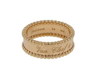 "This exquisite ring from Van Cleef & Arpels showcases the signature Perlée design, renowned for its delicate beaded edge. Crafted from luxurious 18k yellow gold, the ring measures 0.8 cm in width and 0.2 cm in thickness, providing a sleek yet substantial feel. Weighing 8.8 grams, it bears the hallmark of quality expected from this prestigious brand. The ring is a size 59, making it a perfect statement piece for any occasion. Its elegant design and high-quality materials ensure it stands out in any jewelry collection.

Victorins Auctions will coordinate all domestic and international shipping. Please allow approximately 10–15 business days for processing. Certain items may require additional handling time depending on their location, origin, or special packaging requirements. By registering for or placing a bid in a Victorins auction, you confirm that you have reviewed, understood, and agreed to our Shipping, Payment, and Auction Policies."
