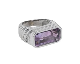 "This exquisite ring features a stunning rectangular amethyst at its center, complemented by shimmering diamonds on the side. Crafted from 18k white gold, this modern piece is both elegant and eye-catching. Measuring approximately 1.1 cm in width, 2 cm in length, and 0.8 cm in thickness, it has a weight of 14 grams. The diamonds weigh about 0.15 carats, adding a touch of sparkle. With a ring size of 49, resizing is possible. A perfect addition to any jewelry collection!

Victorins Auctions will coordinate all domestic and international shipping. Please allow approximately 10–15 business days for processing. Certain items may require additional handling time depending on their location, origin, or special packaging requirements. By registering for or placing a bid in a Victorins auction, you confirm that you have reviewed, understood, and agreed to our Shipping, Payment, and Auction Policies."
