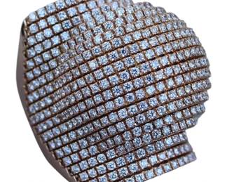 "This exquisite dome ring is crafted from 18 karat rose gold and features 5.20 carats of stunning G/VS quality diamonds. Designed with a unique pave setting, the ring weighs 35.73 grams and is a size 7.25. The intricate craftsmanship showcases high-quality Italian design, with no visible scratches or damage, making it an exceptional piece for any jewelry collection. Its luxurious and eye-catching appearance is perfect for formal occasions or as a statement accessory.

Victorins Auctions will coordinate all domestic and international shipping. Please allow approximately 10–15 business days for processing. Certain items may require additional handling time depending on their location, origin, or special packaging requirements. By registering for or placing a bid in a Victorins auction, you confirm that you have reviewed, understood, and agreed to our Shipping, Payment, and Auction Policies."
